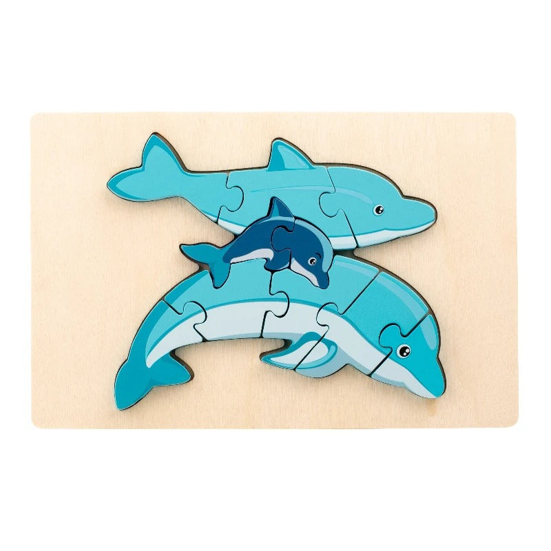 Blue dolphin family puzzle with adult and baby dolphin pieces