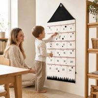 Child playing with the Advent Calendar Toddler – Fabric Wall Calendar 24 Pockets