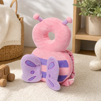 Baby Head Protector Bee Design Walking Safety Pillow set out on a real table at home