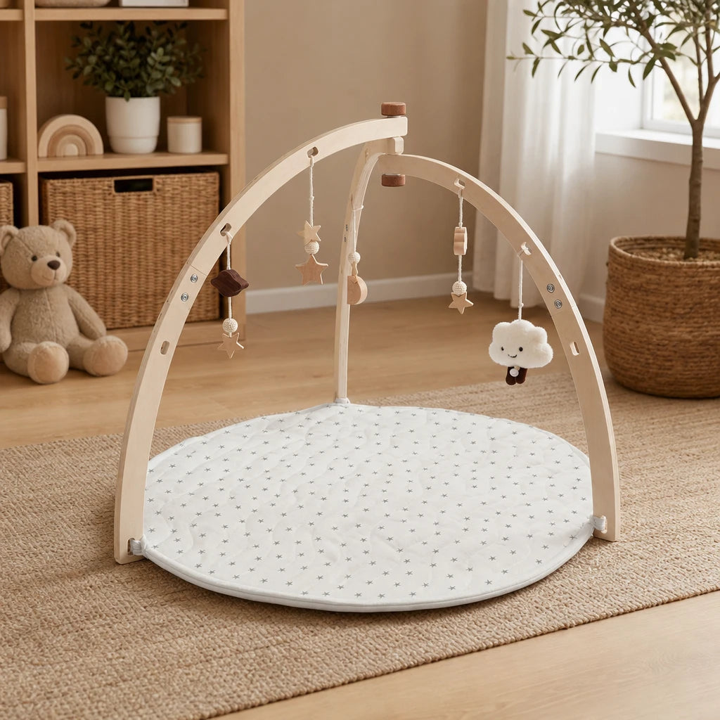 Baby Play Gym Wooden Arch & Mat set out on a real table at home