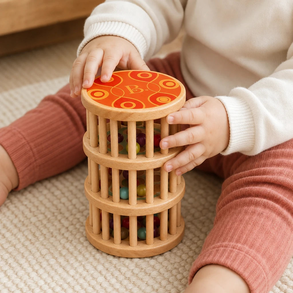 Close-up of a child's hands using the Baby Rain Stick Wooden Sensory Toy