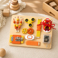 Busy Board for Toddlers with Sensory Activities set out on a real table at home