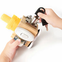 Child's hands turning the key and bolt on the wooden busy cube