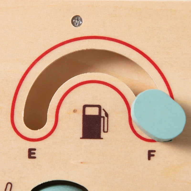 Close-up of the fuel gauge slider on the wooden car dashboard