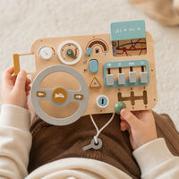 Close-up of a child's hands using the Car Busy Board - Wooden Activity Dashboard