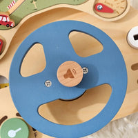 Blue wooden steering wheel mounted on the car activity board