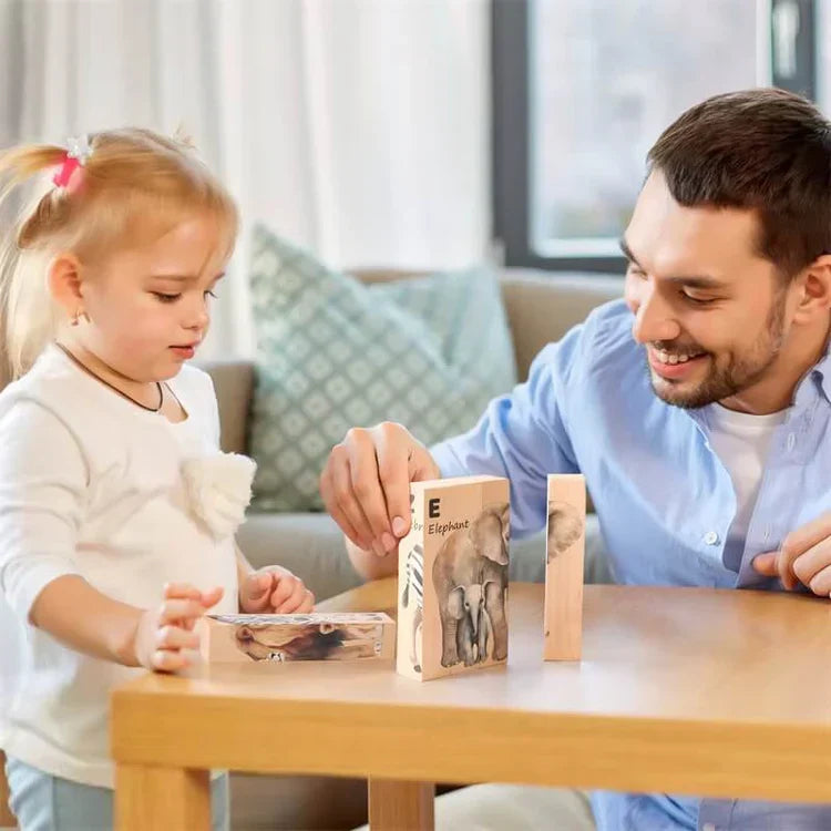 Girl and adult playing with the rotating animal puzzle at a table