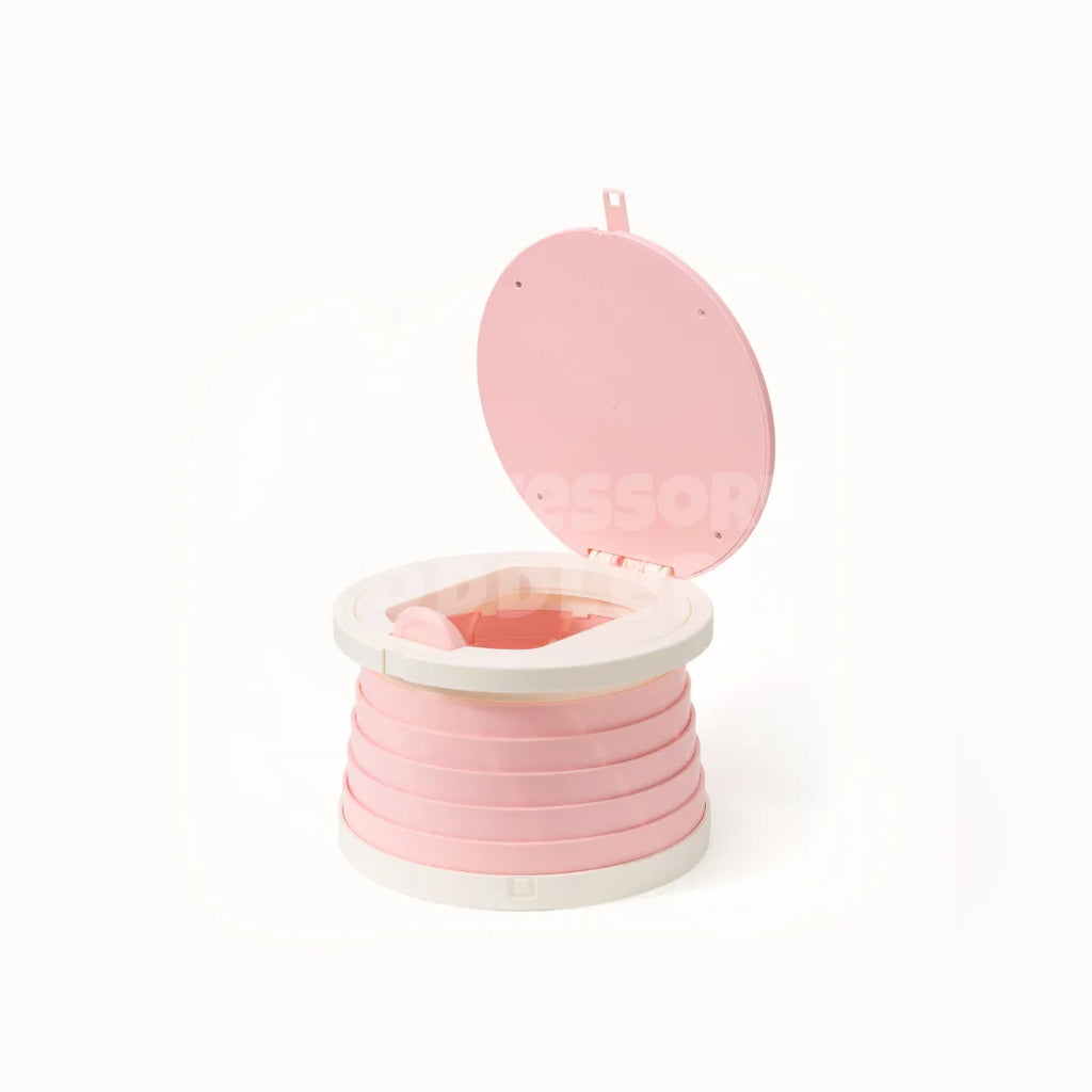 Pink foldable travel potty with the lid open