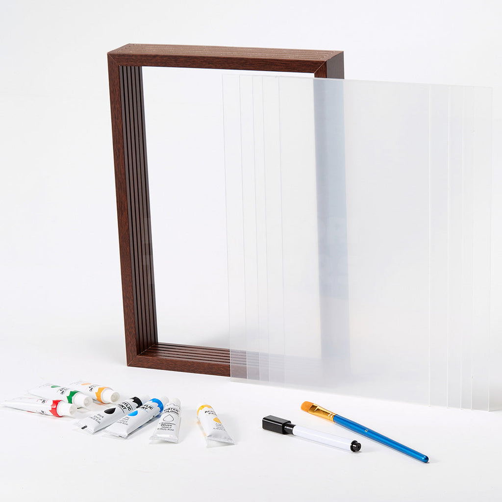 Wooden handprint frame shown open with glass panels and paint tools