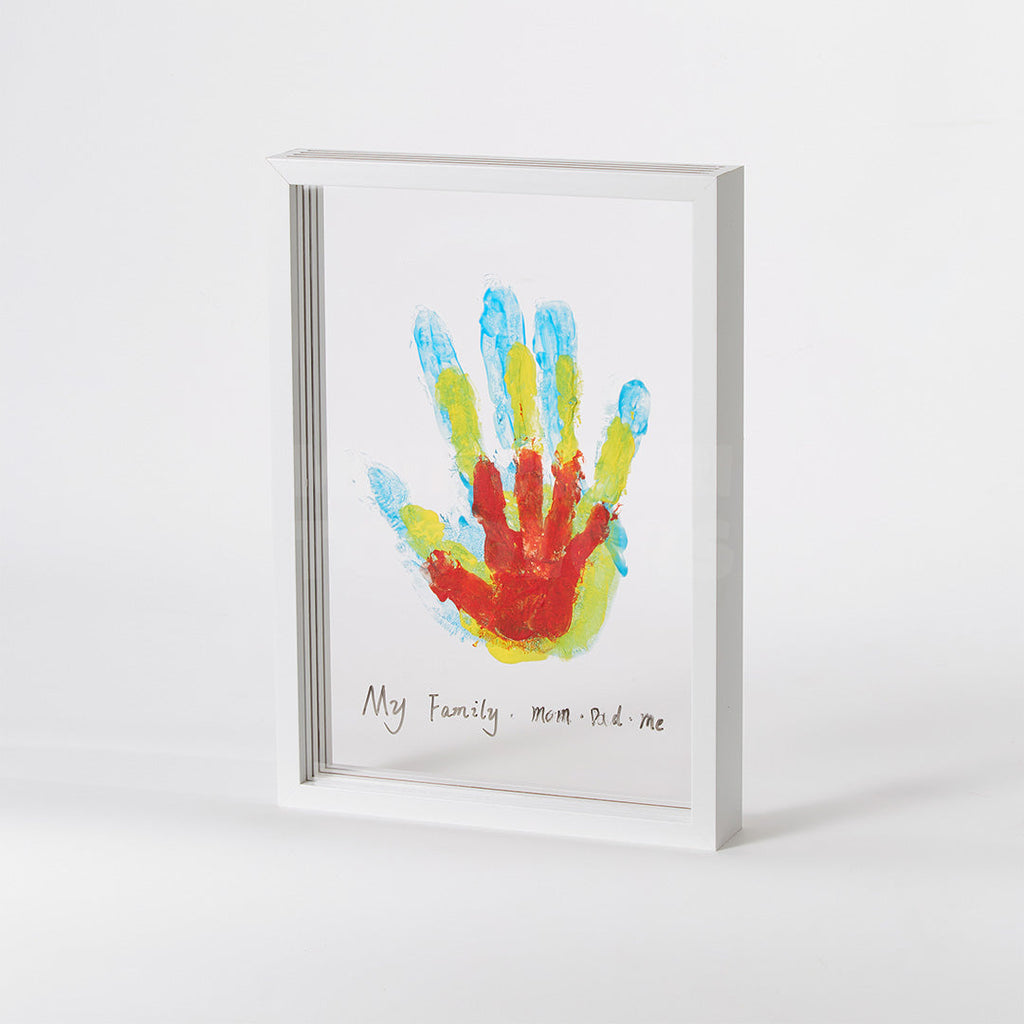 White handprint frame displaying a family of painted handprints
