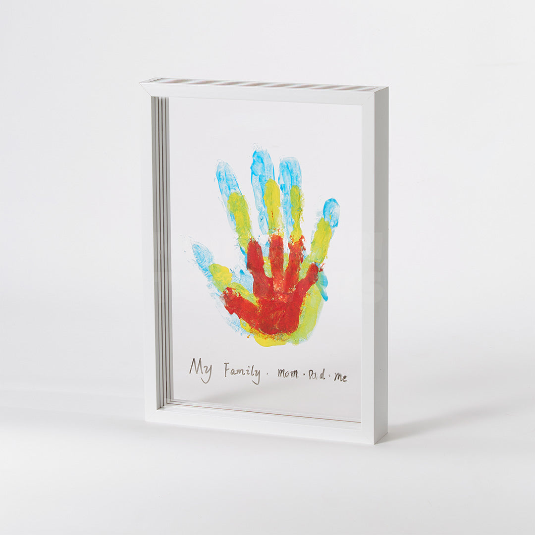 White handprint frame displaying a family of painted handprints