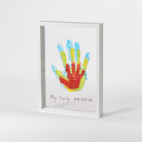 White handprint frame displaying a family of painted handprints