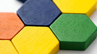 Close-up of the hexagon puzzle tiles in blue, yellow, green and orange