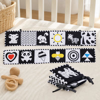 High Contrast Baby Book Black & White set out on a real table at home
