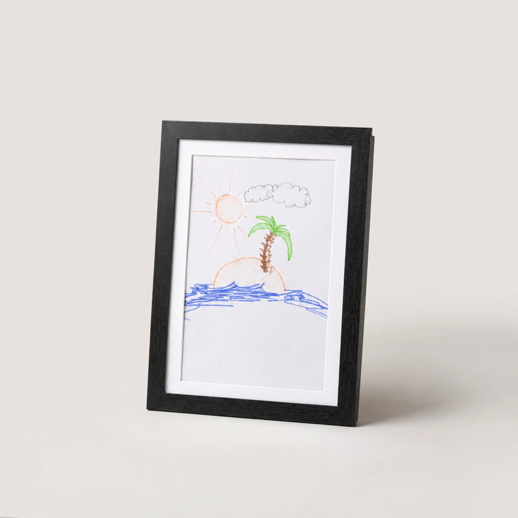 Black kids art frame standing upright with a crayon drawing