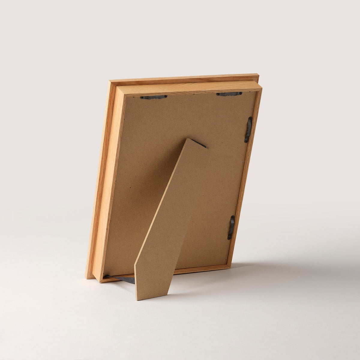 Rear of the wooden art frame with the tabletop stand extended