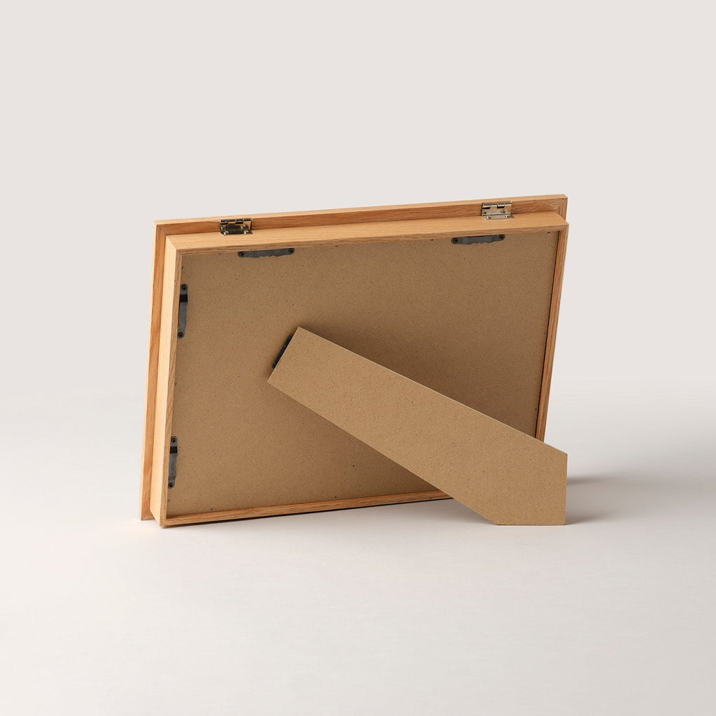 Wooden art frame lying flat with the stand folded out
