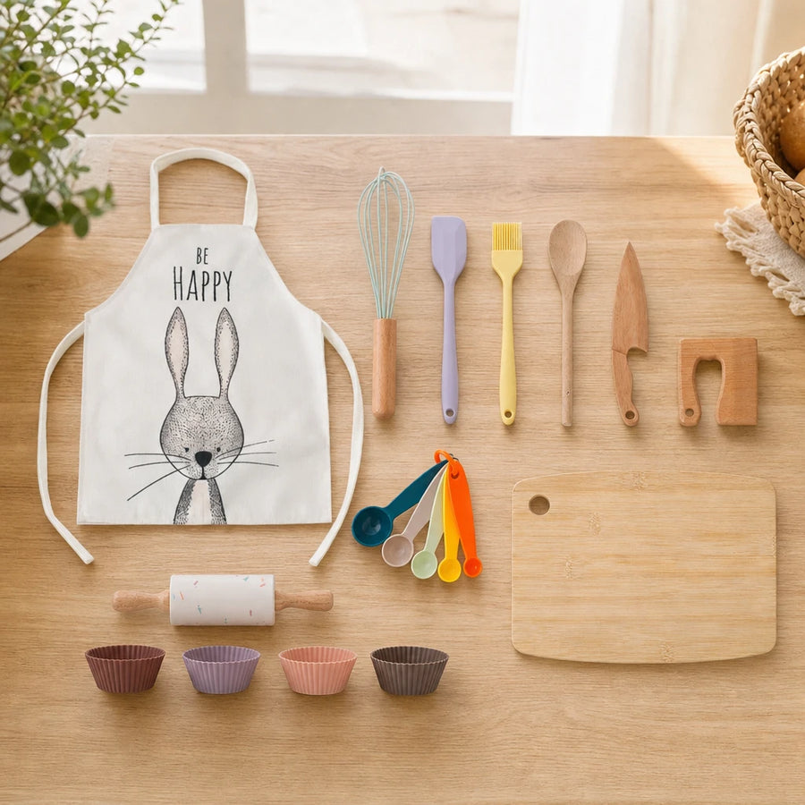 Kids Cooking Set Wooden Kitchen Tools with Apron set out on a real table at home