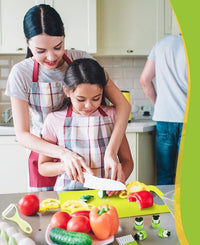 Mother and daughter chopping vegetables together in the kitchen