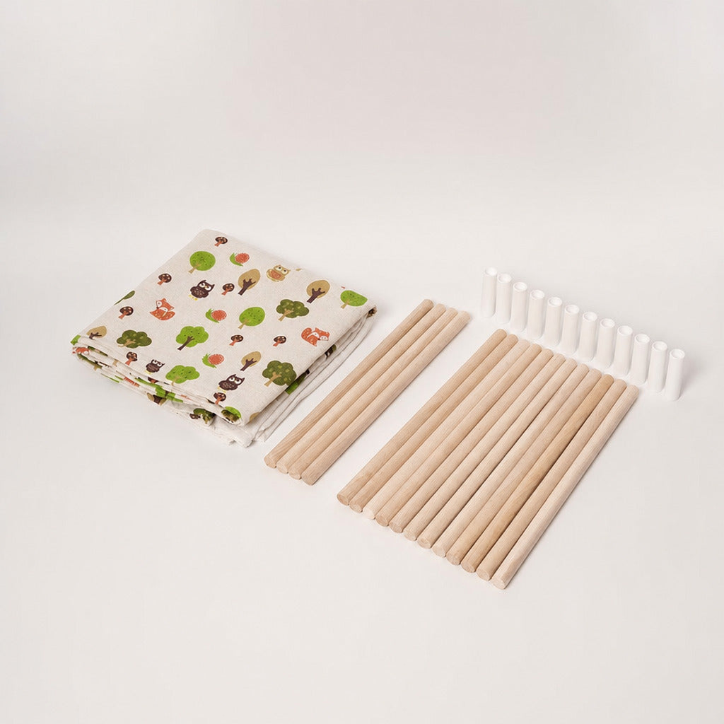 Teepee tent contents laid flat: printed canvas, wooden poles and ties