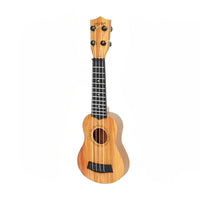 Wooden kids ukulele front view showing the sound hole and bridge