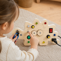 LED Busy Board Dinosaur Switch & Gear Toy - utilisation close up