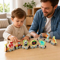 Child playing with the Magnetic Animal Train - 11-Piece Wooden Set