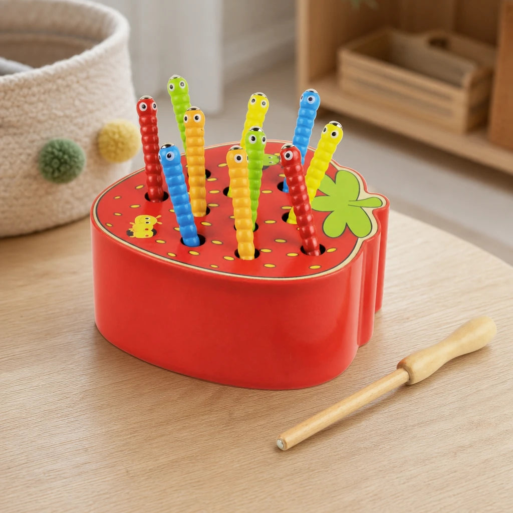 Magnetic Caterpillar Toy Strawberry Base set out on a real table at home