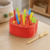 Magnetic Caterpillar Toy Strawberry Base set out on a real table at home