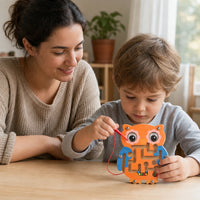 Child playing with the Magnetic Maze Toy - Owl Design