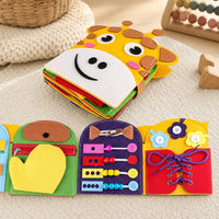 Montessori Busy Book Giraffe Sensory Activity Toy set out on a real table at home