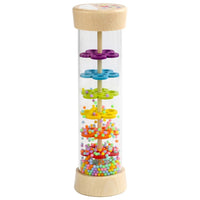 Wooden rainbow rainstick standing upright with coloured beads inside