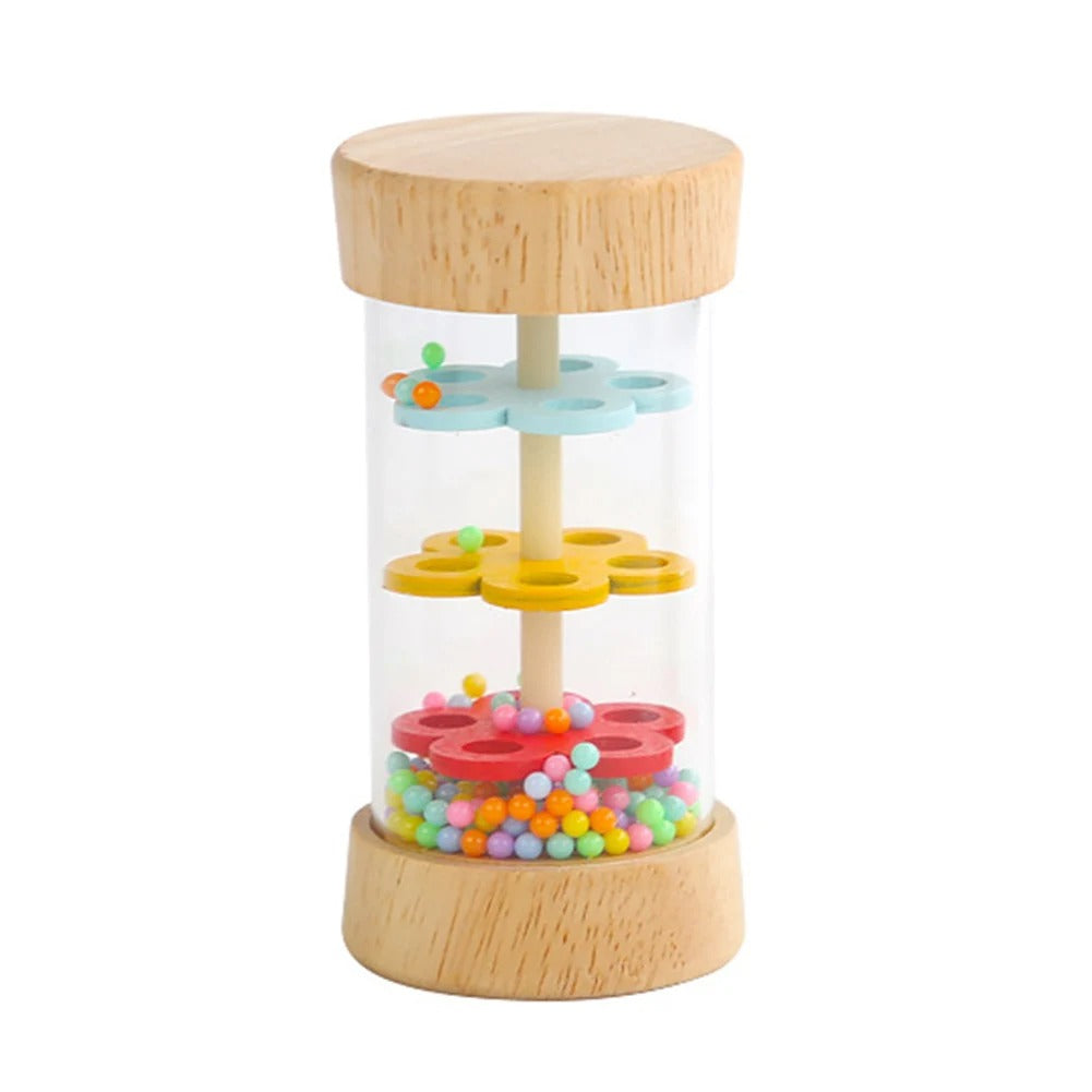 Wooden rainstick with pastel discs and rainbow beads at the base