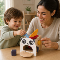 Child using the Montessori Tissue Box Toy Panda Shape Sorter