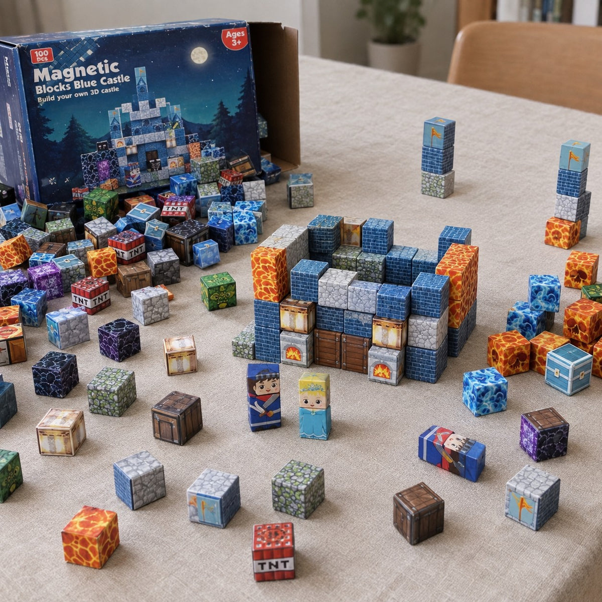Blue Castle magnetic cubes spread on the table, build in progress