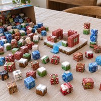 Christmas Village magnetic cubes spread on the table, build in progress