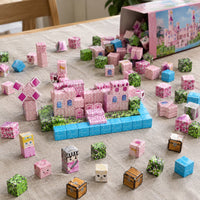 Pink Castle magnetic cubes spread on the table, build in progress