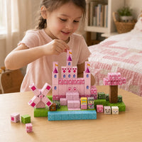 Child building the Pink Castle set with magnetic cubes
