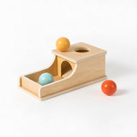 Wooden object permanence box with ramp and two balls