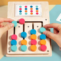 Hands sliding coloured discs along the pattern matching board