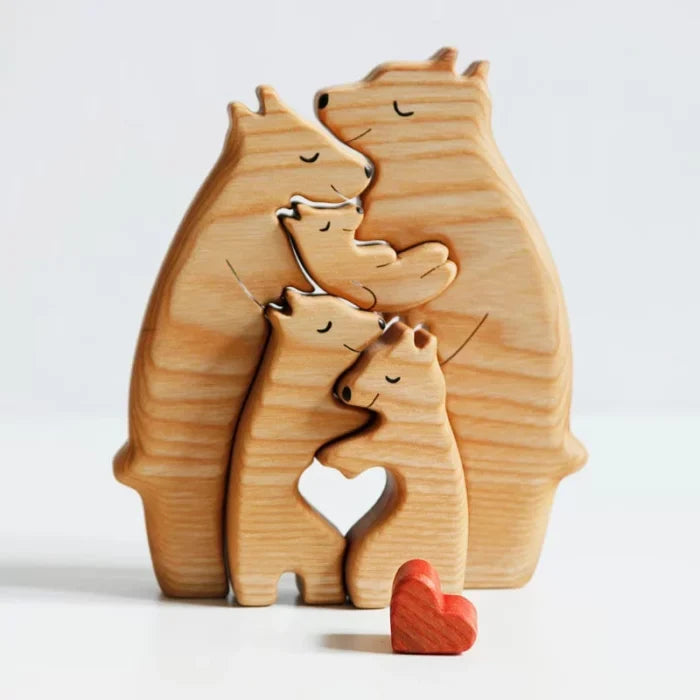Wooden bear family puzzle with a heart piece on a white background