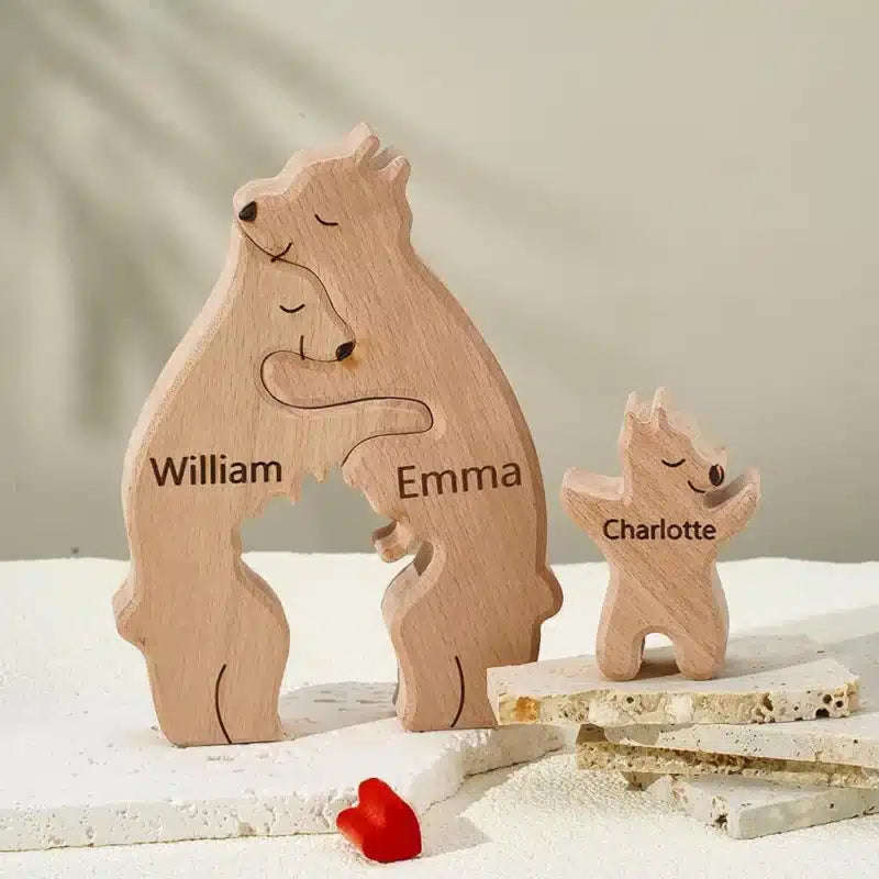 Three-bear family puzzle with engraved names on a plinth