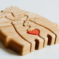 Close-up of the bear puzzle's interlocking cut and heart inlay