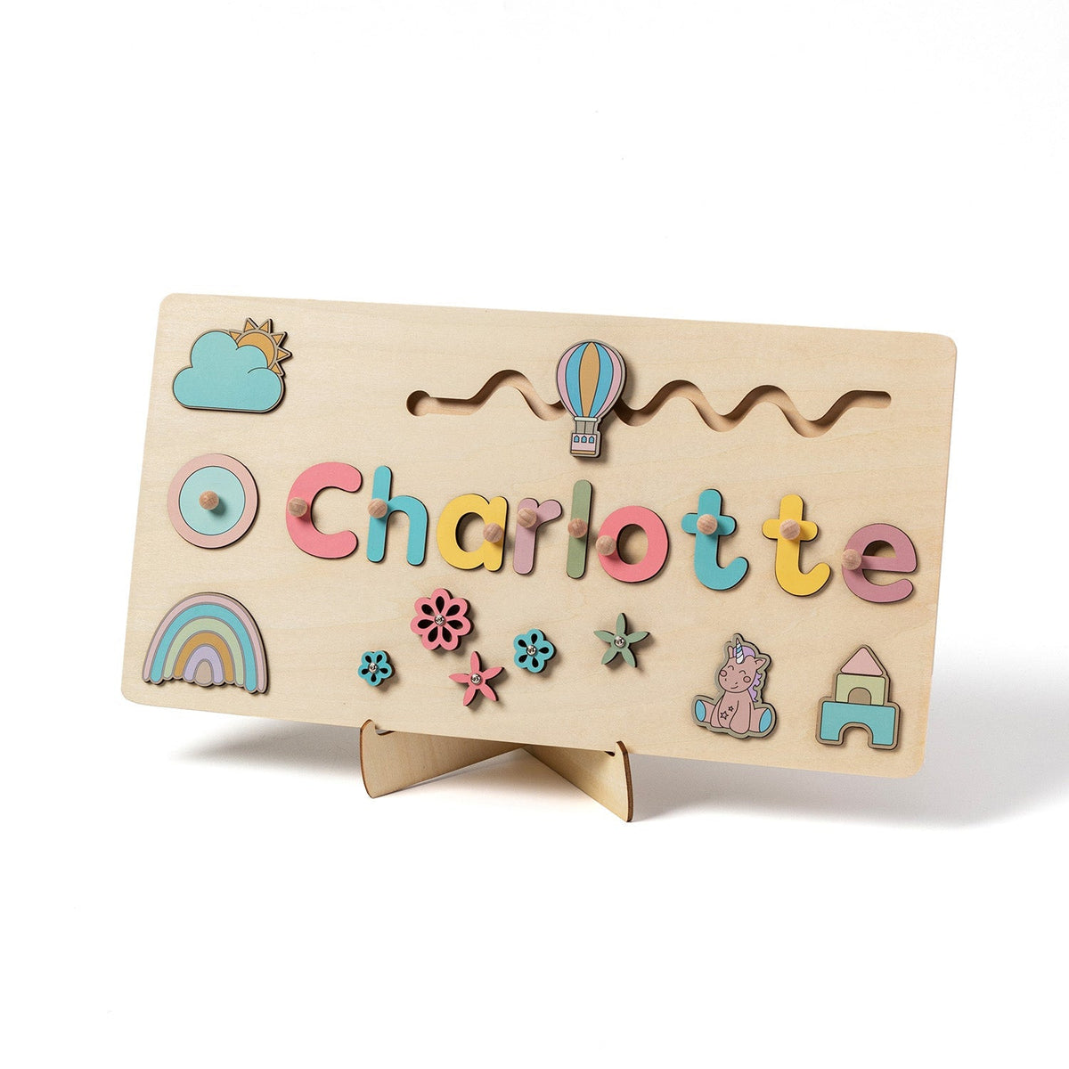 Name puzzle spelling Charlotte with rainbow and balloon pieces