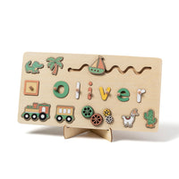 Name puzzle spelling Oliver with train, cactus and llama pieces