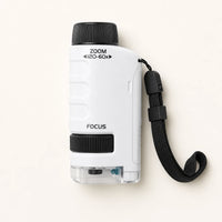 Pocket Microscope for Kids with LED Light shown complete on a plain background
