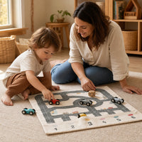 Child playing with the Road Play Mat with 6 Wooden Cars & Die