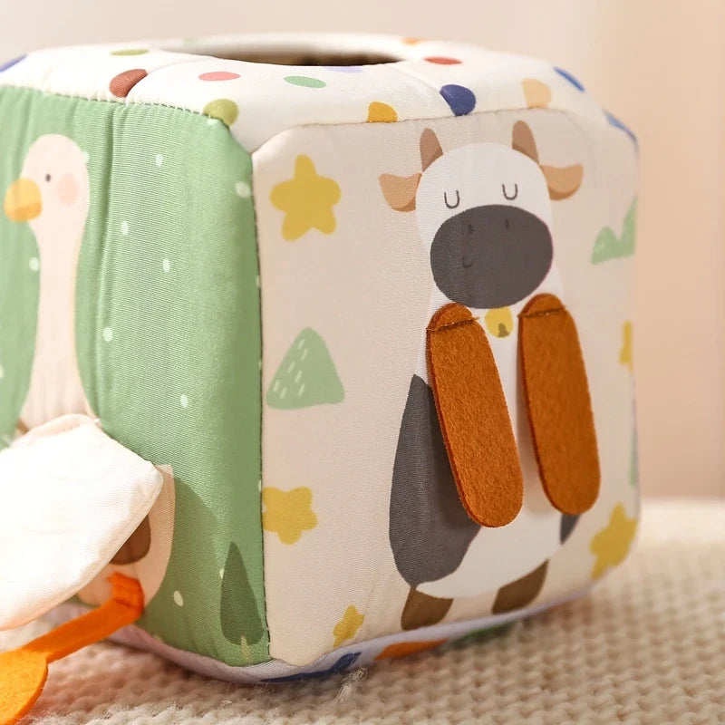 Sensory cube cow panel with textured fabric detail