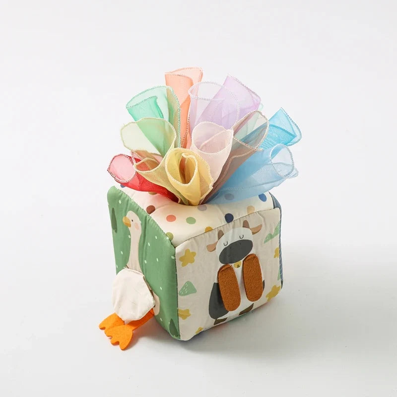 Sensory cube with a full bunch of pastel scarves on top