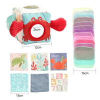 Crab-themed sensory cube with scarves, cards and cloth swatches